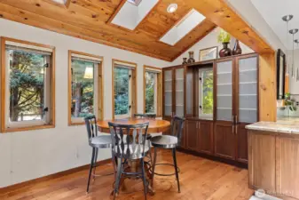 Eating nook with cabinets and skylights