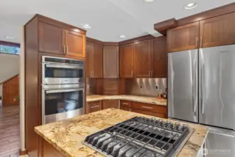 New cooktop with newer refridgerater and stove.