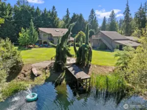 Pond, dock, lawn, home,  garage/shop and bonus room