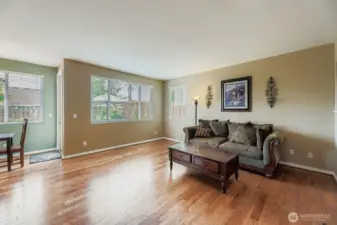COMFORTABLE AND OPEN FAMILY ROOM WITH EASY ACCESS TO BACK DECK AND KITCHEN.