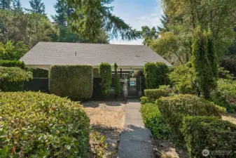 A one minute walk along a the trail in back of the home to the community outdoor pool area with bathrooms.  A portion of the area are covered and feature picnic table and chairs.