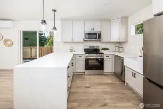Notice the cool farm style sink and he full wall of tile details.  All new energy efficient kitchen appliances included in the Built Green home.