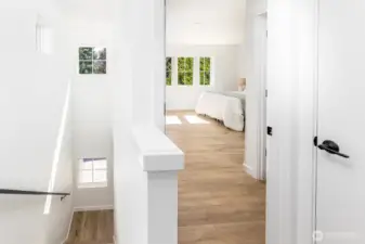 Stairway up to the tope floor bedrooms is brightly lit with southern light.