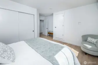 Two separate closets, specifically designed to hide the cords of your wall mounted TV on the wall across from the bed.
