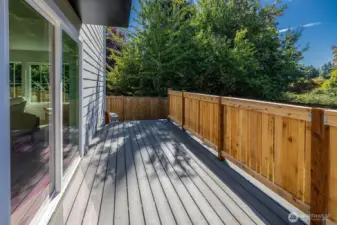 Another view of the deck.  Stairs lead down for access to gardening, playtime, parking (off alley), and talk to your broker about fencing options to maintain any fur friends!