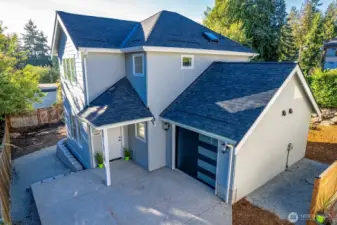 Just to the left of the photo, notice slight steps down towards the bark area of the back yard.  Gate access from alley allows for owners to pull in from that area to access the back yard and use for off street parking.