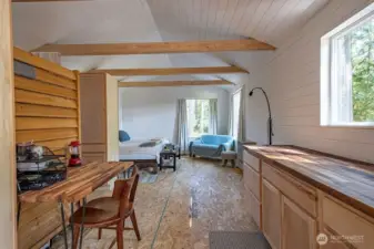 Cabin is very spacious inside with vaulted ceiling and exposed beams.