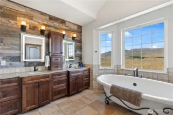 Primary en-suite bathroom with garden tub and dual vanity