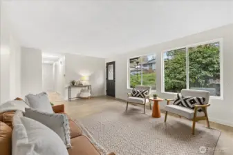 Light-filled home. Front door opens to living room.