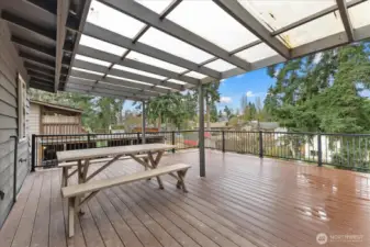 Access to rooftop deck right off the kitchen. Covered for year round enjoyment.