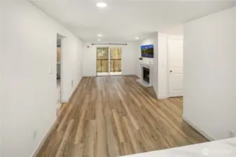 Dining and living room all one big space, looked from kitchen, so this is what you see when cooking :) newer LVP floring throughout the property.