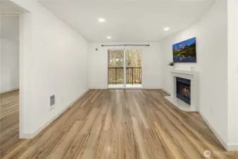 Living room watched from dining room perspective. Curtain rod stays with the purchase of the property.
