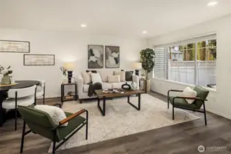 A generous space to relax or entertain. A large picture window overlooks the rear yard and fills the room with natural light.