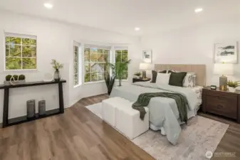 Luxurious primary suite with bay window