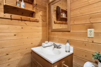 Closer view of the vanity and storage.