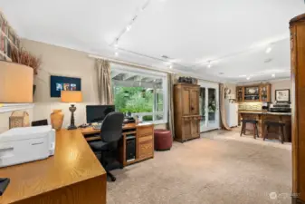 Basement flex space with French doors to patio and deck