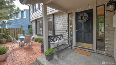 Extended covered front porch greets your guests upon arrival.
