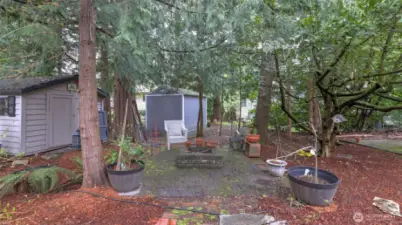Great space in this backyard to have a firepit!