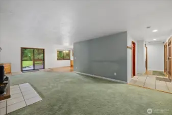 Lovely brick pellet stove is a great heat source. Foyer and hallway leads to 2 bedrooms.