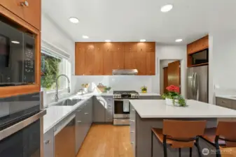 Kitchen includes wet bar & island with seating