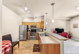 Convenient breakfast bar for morning beverages and room for a table in the kitchen.