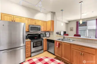 Practical well-laid out kitchen with view to living room.
