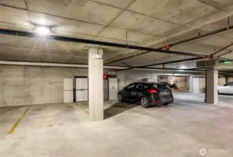 Take elevator down to designated space 40 in secured parking garage with room for storage cabinet.