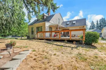 Back of main house with nice sized deck. Skylights bring in a lot of light