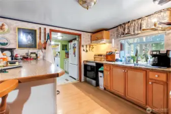 more of the kitchen. Lots of counters and cabinets here