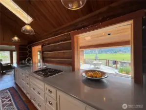 Propane cook top with down draft. Custom built, this deep counter top is ______ feet in length.