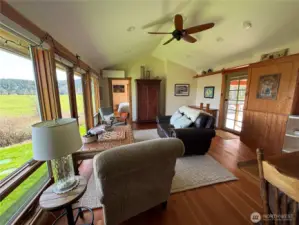 Open door in the middle of the picture accesses the main bedroom ensuite. Glass door to the right accesses the covered porch and deck area.