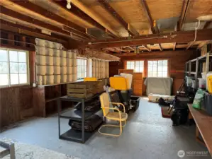 The interior of the 30x30 storage building. Built in cubby holes, shelving and a pull down ladder for loft storage. Power has been stubbed out to this structure. One new window installed. Dry crawl space with head room to store your kayaks and outdoor gear.