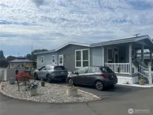 Large corner lot with new pavement and fenced yard.