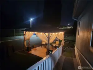 Gazebo lit up at night.