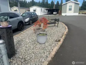 Side of driveway.