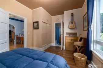 Built-in closet in the main floor bedroom.  Dining room through door on left, ensuite bath through door at back of room.