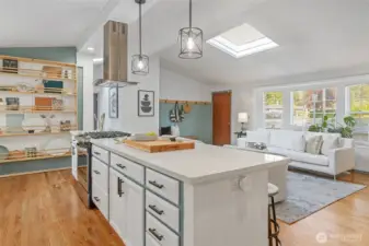 Center island with gas cooking and built in shelving for extra storage or display.