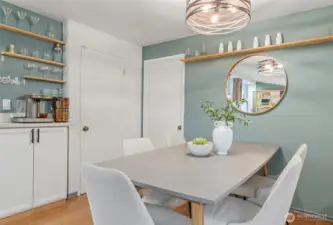 Dining space with cabinet perfect for a coffee bar.