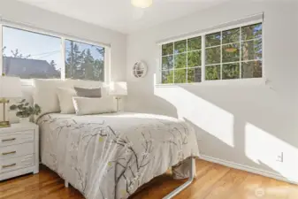 Third bedroom with corner windows with yard outlooks.