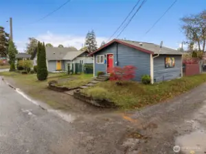 Plenty of parking both on property and off street. photo of cottage with main home in the distance.