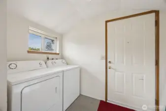 Easily accessible utility room off the kitchen with washer and dryer included.