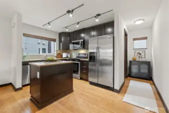 Entering the main level. half bath is just past kitchen to the right