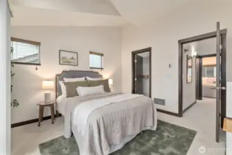 Large primary with vaulted ceilings and walk-in closet