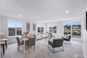 Open-concept living and dining area with direct access to the exterior deck.