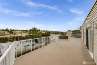 Spacious exterior deck, approximately 515 sq. ft., facing south.