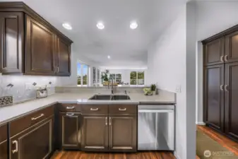 Open kitchen with breakfast bar.