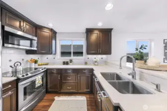 Open kitchen with breakfast bar.