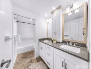 Ensuite full bath with dual vanities.