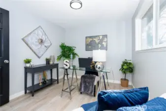 From the reverse angle, the room’s flexibility stands out even more. It could easily function as a guest room, workout space, hobby room or additional lounge. Neutral tones and clean finishes make it move-in ready for whatever use fits your lifestyle. The staging highlights comfort without limiting imagination.