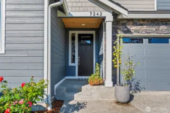 The inviting covered entry with an 8 ft door